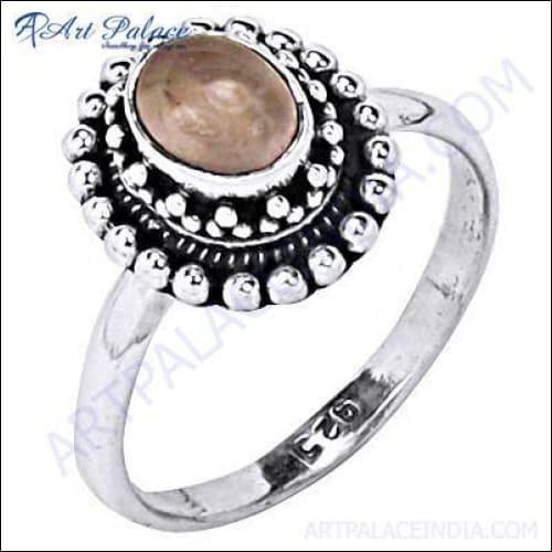 A beautifully crafted 925 sterling silver ring featuring a rose quartz gemstone, showcasing intricate ethnic Indian design.
