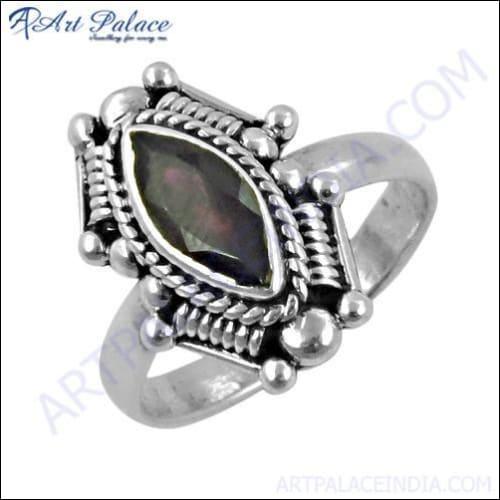 A beautifully crafted 925 sterling silver ring featuring a deep red garnet gemstone, showcasing intricate Indian ethnic design.