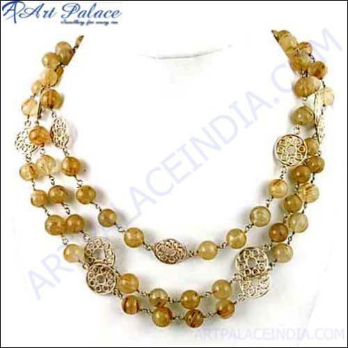 A beautiful 925 sterling silver necklace featuring a golden rutile quartz gemstone, showcasing unique needle-like inclusions and exquisite craftsmanship.