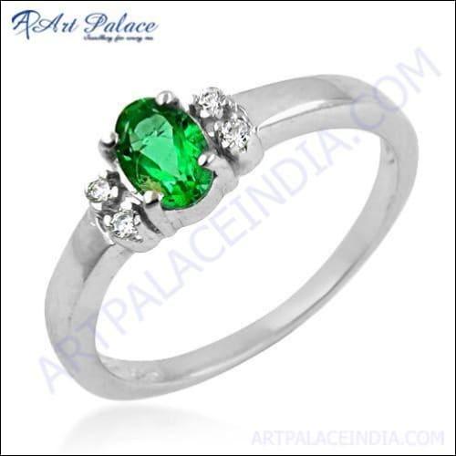 A beautiful 925 sterling silver ring featuring a royal green cubic zirconia center stone surrounded by white cubic zirconia accents, showcasing elegance and style.