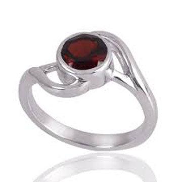A stunning 925 sterling silver ring featuring a round garnet gemstone, showcasing intricate artisanal design and rich red color.