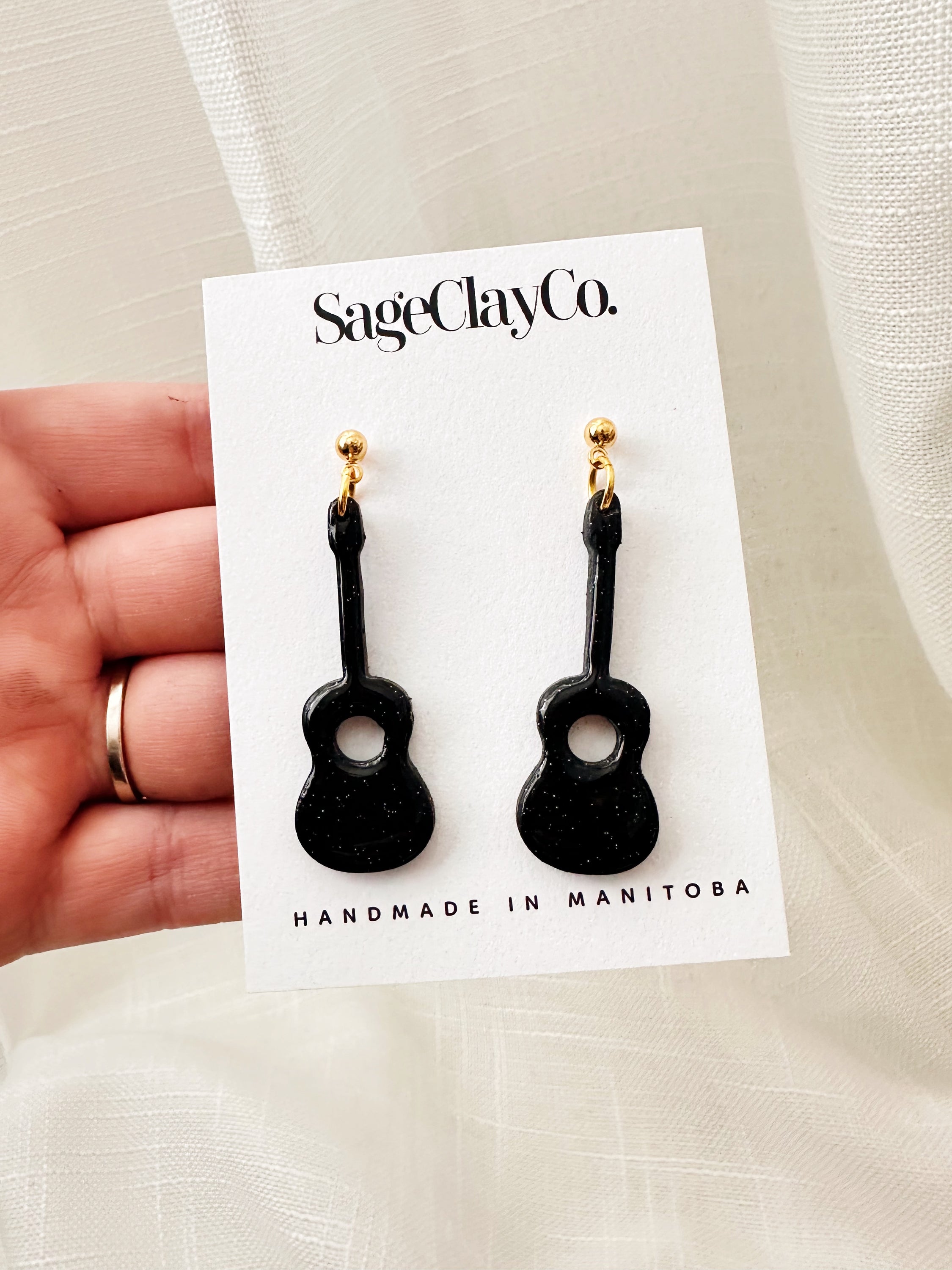 Handmade polymer clay Acoustic Guitar Dangles earrings inspired by TS Reputation, featuring unique designs and hypoallergenic posts.