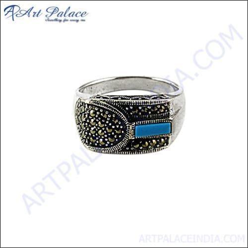 Adjustable gun metal ring featuring synthetic turquoise stone, showcasing modern design and craftsmanship.