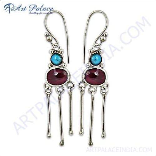 Adorable silver earrings featuring natural garnet and turquoise gemstones, showcasing a unique and elegant design.
