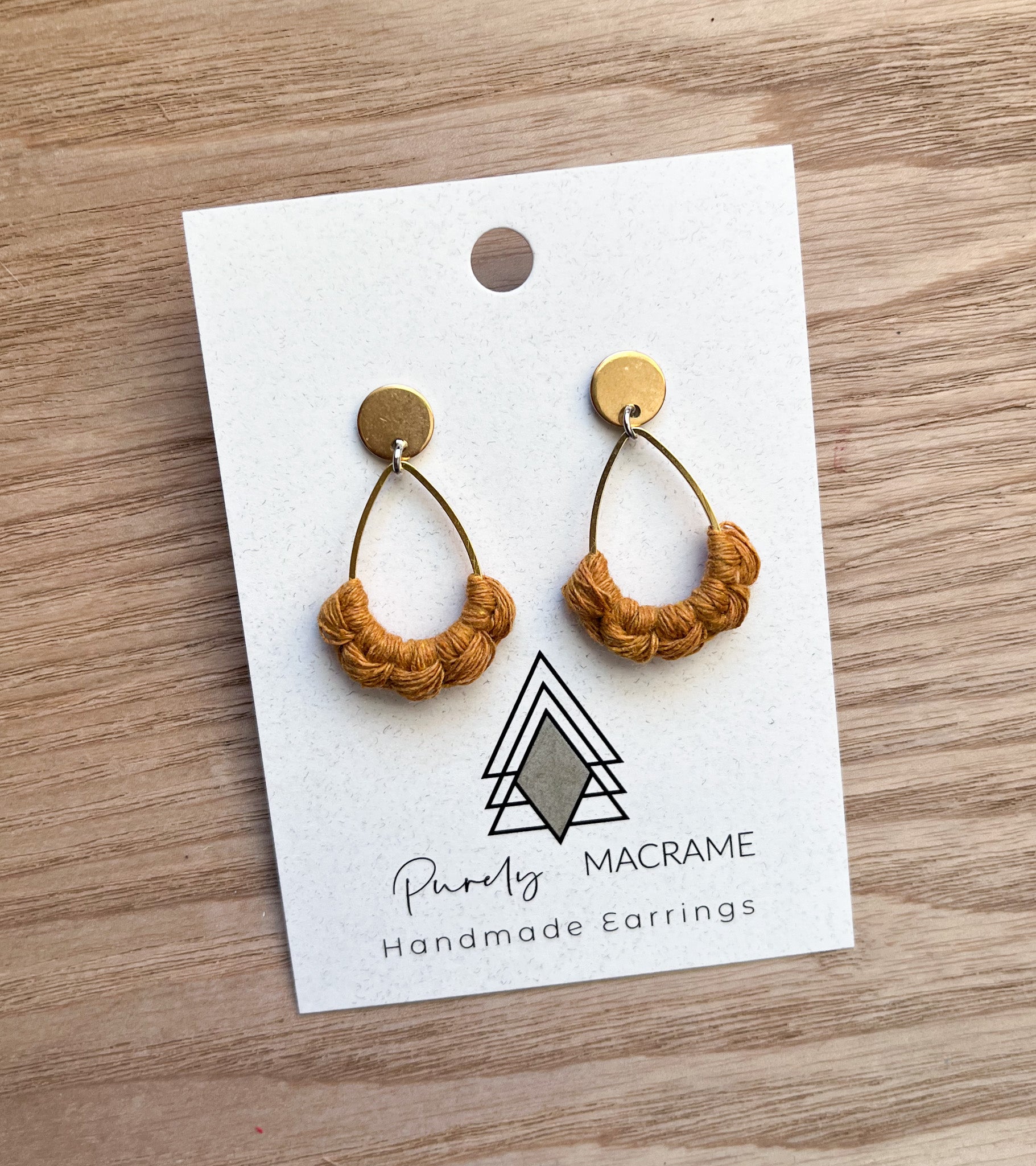A pair of Autumn Mustard Stud Teardrop earrings made from 100% cotton cord, showcasing a vibrant mustard color and elegant teardrop shape.