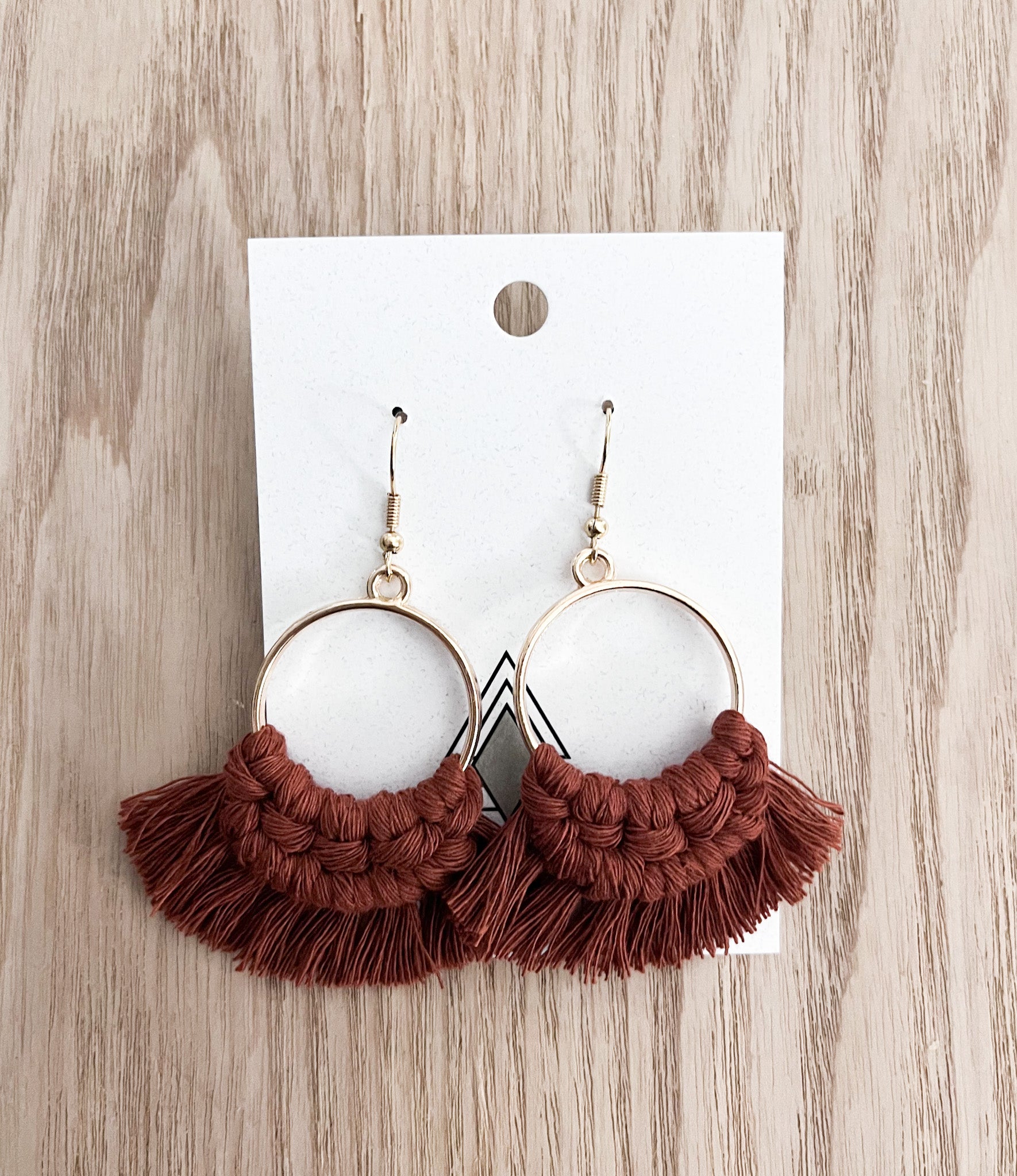 A pair of Autumn Rust Rounds made from 100% cotton cord, showcasing a rich rust color and lightweight design.