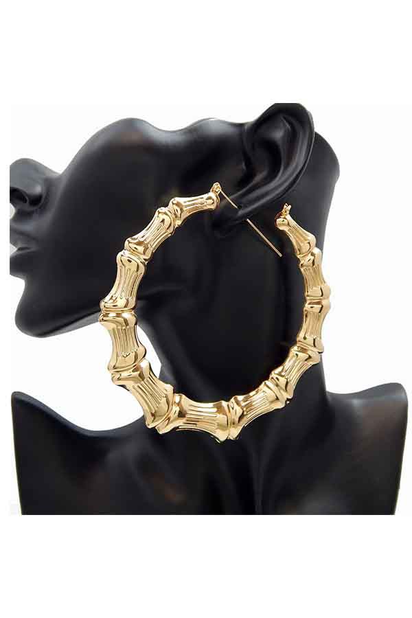 A pair of elegant bamboo textured hoop earrings with a polished finish, featuring a secure lever back closure.