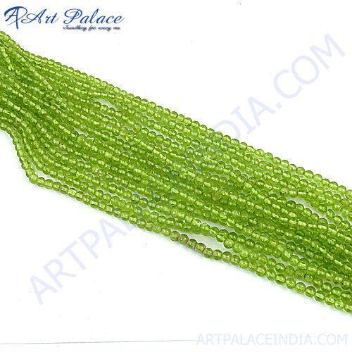 Natural Peridot loose beads strands showcasing vibrant green color and irregular shapes, perfect for jewelry making.