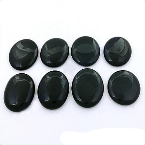 A collection of Black Onyx Round Cabochon Loose Gemstones showcasing their smooth surface and deep black color, perfect for jewelry making.