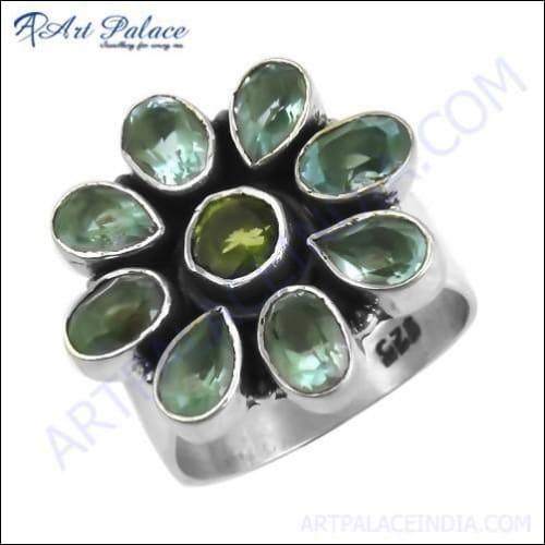 Elegant Blue Topaz and Peridot gemstone ring set in 925 sterling silver, showcasing vibrant blue and green colors.