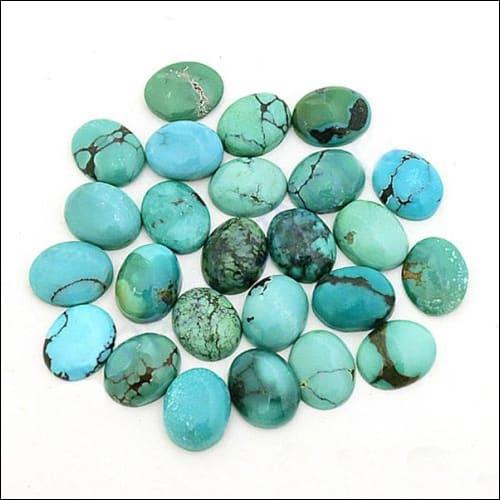 A vibrant blue genuine turquoise loose gemstone showcasing unique patterns, perfect for jewelry making.