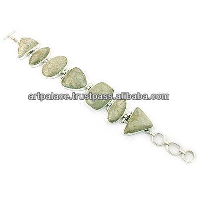 A delicate silver bracelet featuring unique Fossil Jasper gemstones, showcasing earthy hues and intricate patterns.