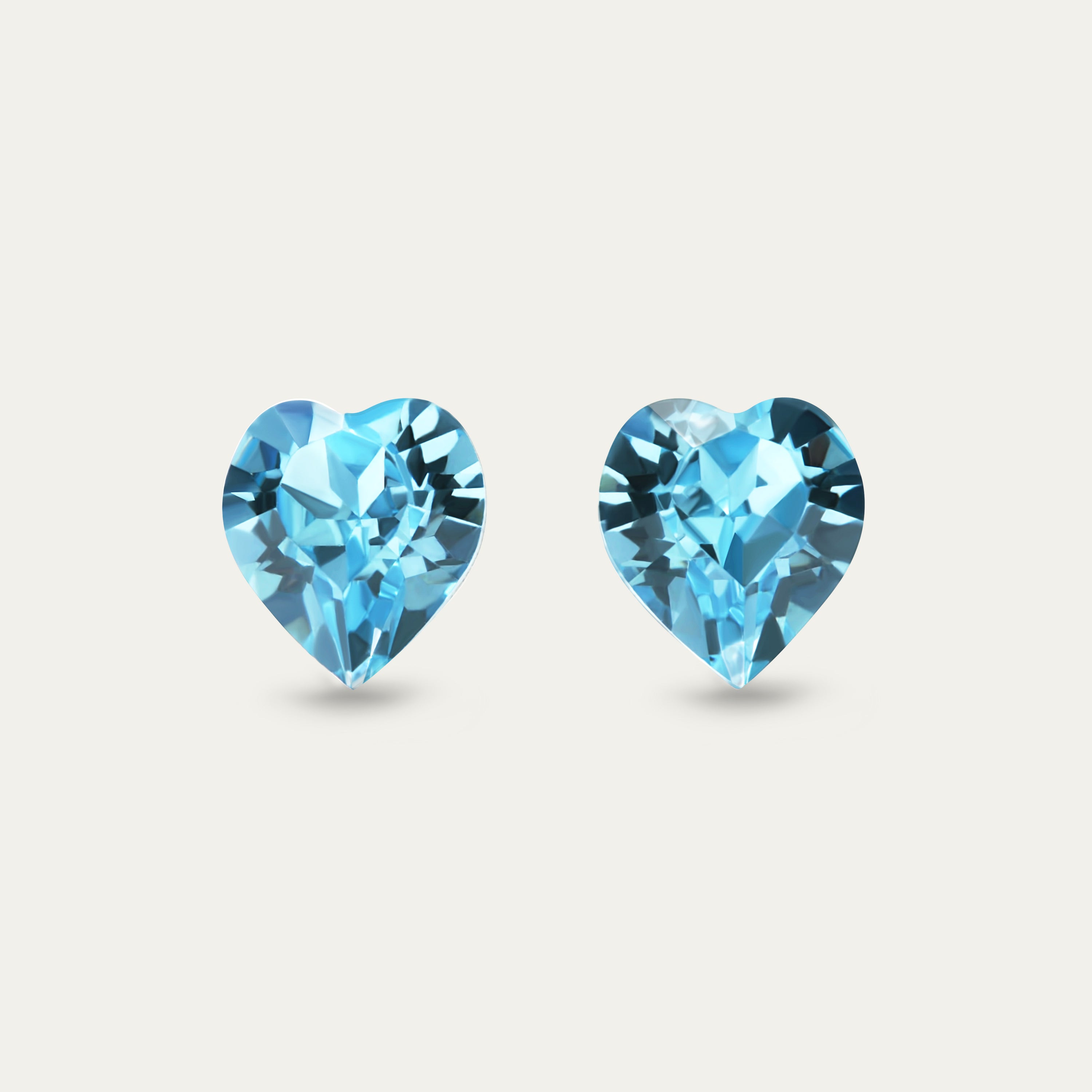 Ciella Aquamarine 8mm Blue Color Crystal Heart earrings, featuring a stunning heart design in blue crystal set in hypoallergenic stainless steel.