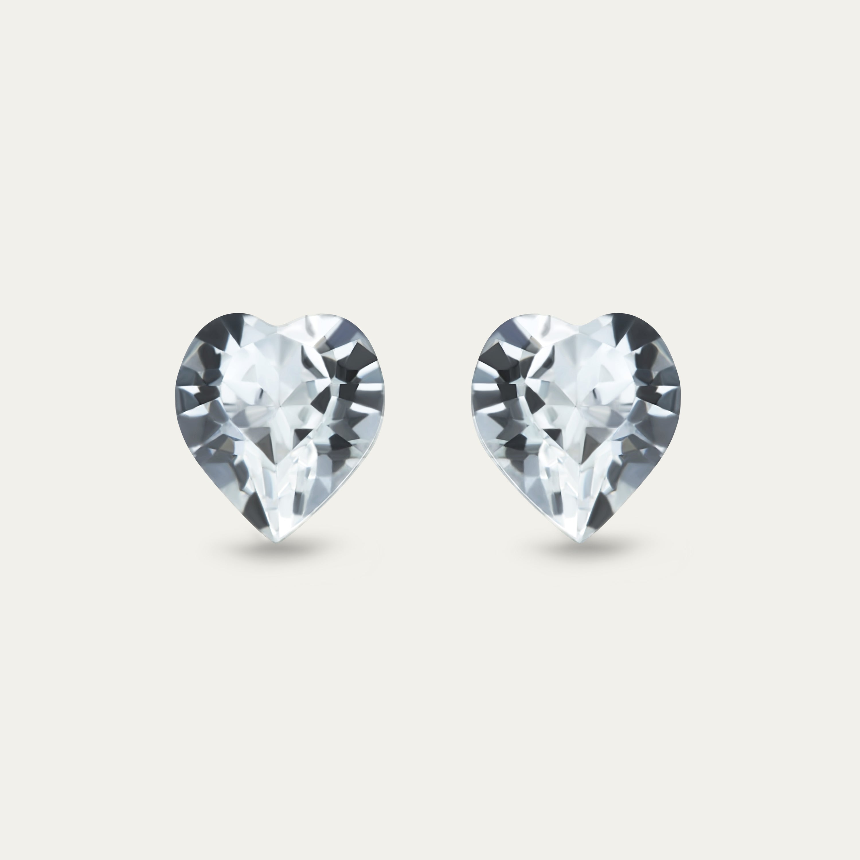 Ciella 8mm Clear & White Color Crystal Heart earrings on a soft background, showcasing their elegant design and sparkle.