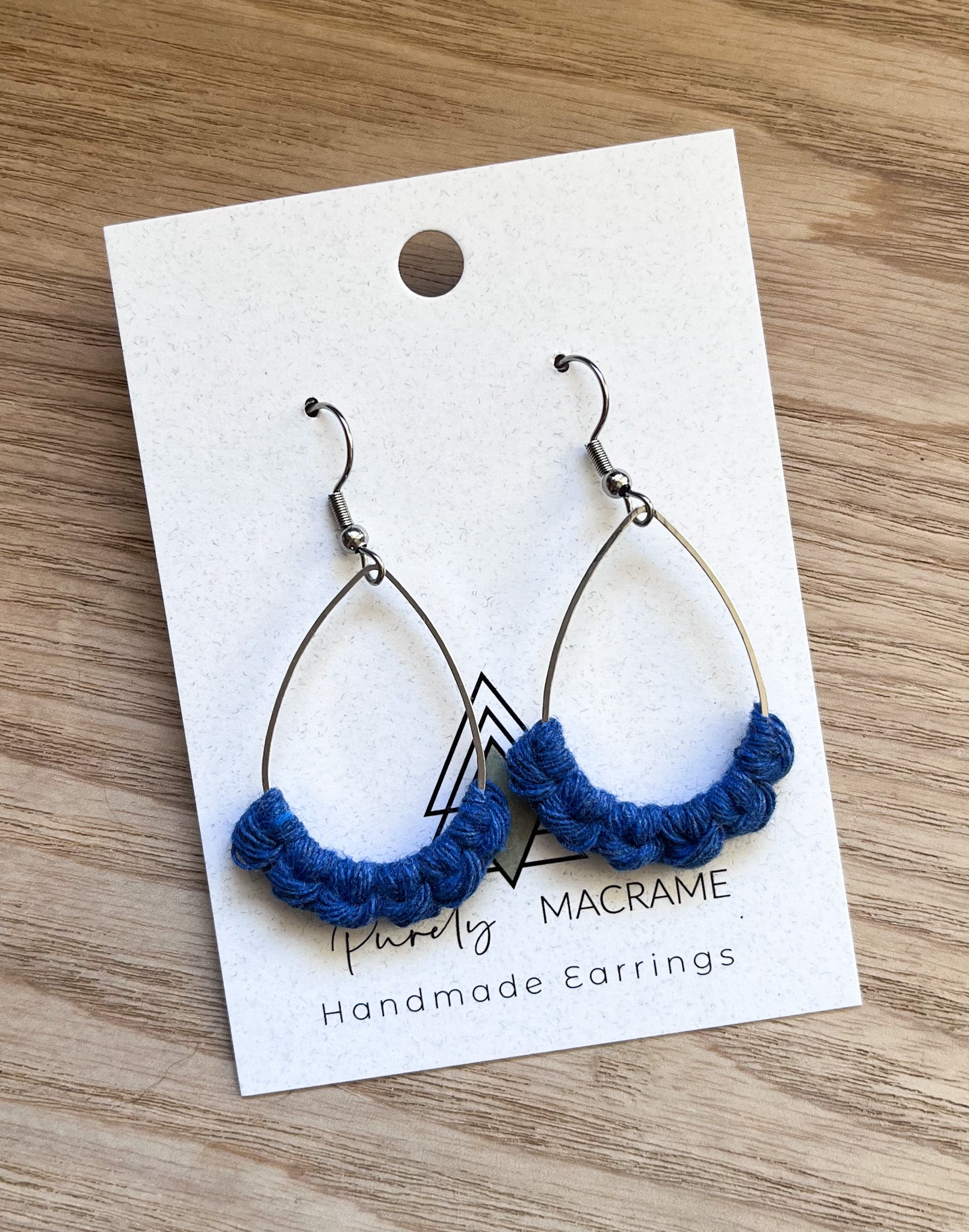 Elegant Cobalt Silver Teardrop earrings made from 100% macrame cotton, showcasing a lightweight and stylish design.