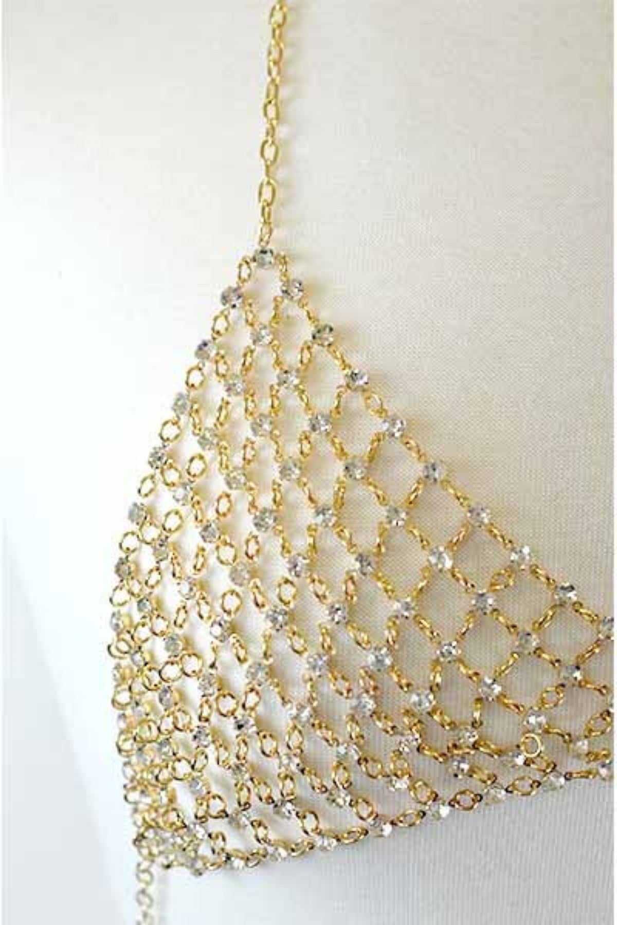 A beautiful crystal encrusted chain link bra chain featuring a lobster claw clasp and adjustable extender, perfect for stylish outfits.