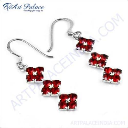 Cute and stylish red cubic zirconia gemstone silver earrings, showcasing their elegant design and vibrant color.