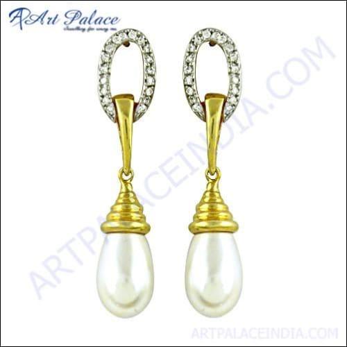 Dazzling gold-plated silver earrings featuring cubic zirconia stones and lustrous pearls, showcasing elegance and sophistication.