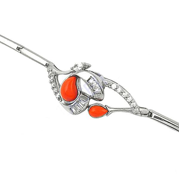 Designer bracelet featuring coral and cubic zirconia gemstones set in 925 sterling silver, showcasing elegance and vibrant colors.