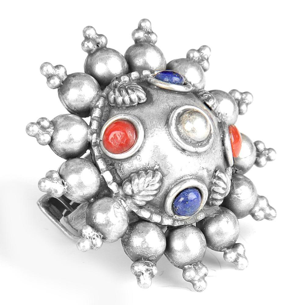 Designer oxidized silver ring featuring coral and lapis gemstones, showcasing intricate craftsmanship and vibrant colors.