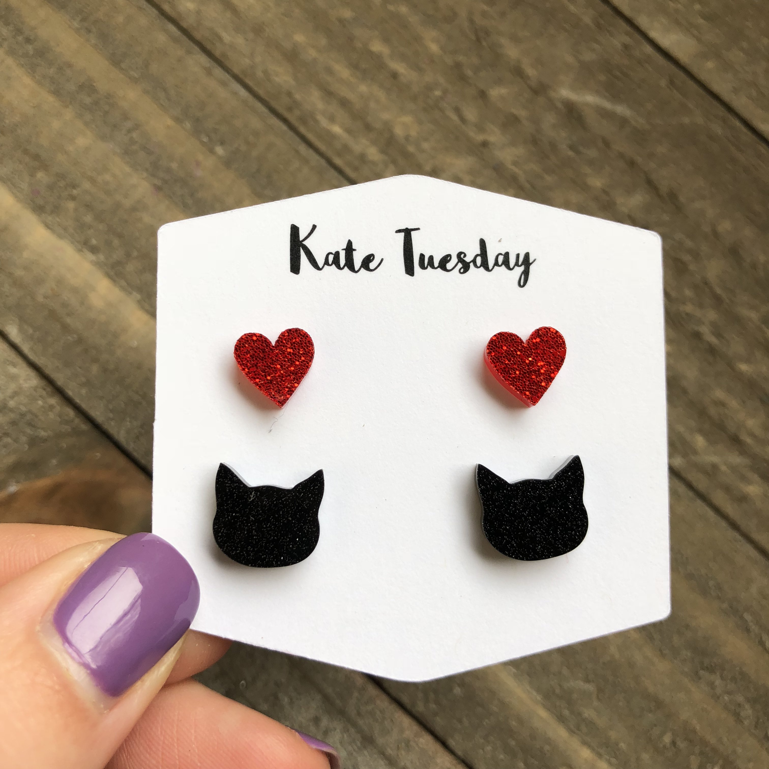 Double set of glittery acrylic earrings featuring a playful cat and heart design, perfect for cat lovers.