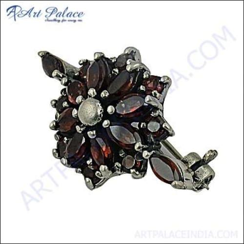 Elegant 925 sterling silver flower brooch featuring a vibrant garnet gemstone, showcasing exquisite craftsmanship and timeless design.