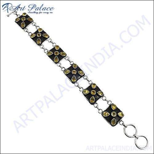 Elegant 925 Sterling Silver Gemstone Bracelets displayed on a soft fabric background, showcasing their intricate design and vibrant gemstones.