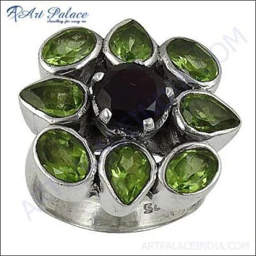 Elegant Black Onyx and Peridot Ring set in sterling silver, showcasing the deep black onyx and vibrant green peridot gemstones.