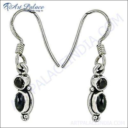 Elegant silver earrings featuring black onyx and smokey quartz gemstones, showcasing a stylish design.
