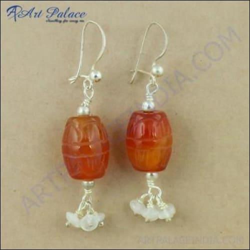 Elegant silver earrings featuring Carnelian and Rainbow Moonstone gemstones, showcasing intricate craftsmanship and vibrant colors.
