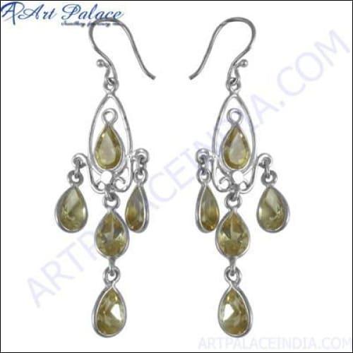 Elegant designer silver gemstone earrings with intricate detailing, perfect for party wear, showcasing a blend of modern and traditional artistry.