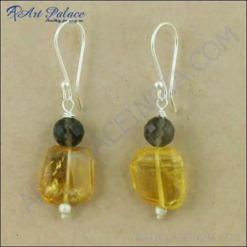 Elegant silver earrings featuring smokey quartz and citrine gemstones, showcasing intricate craftsmanship and a stylish design.