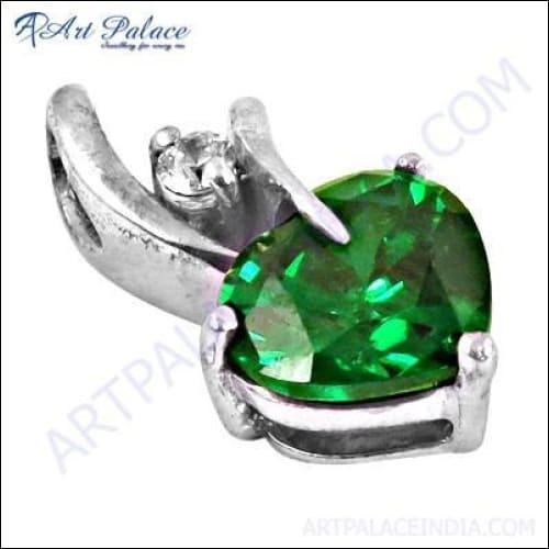Elegant silver pendant featuring cubic zirconia and vibrant green glass gemstone, showcasing intricate design and craftsmanship.