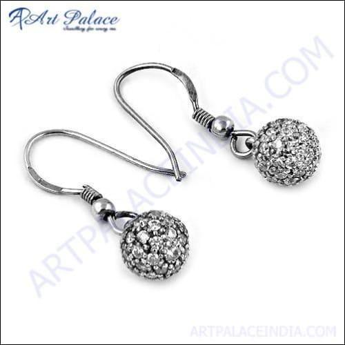 Elegant silver earrings featuring sparkling cubic zirconia gemstones, showcasing a stylish and fashionable design.
