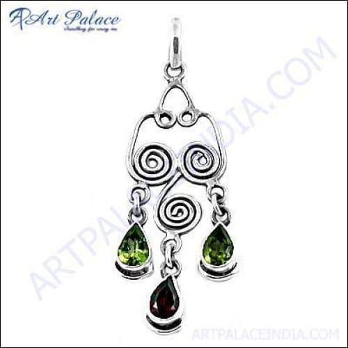 Elegant silver pendant featuring garnet and peridot gemstones, showcasing intricate craftsmanship and vibrant colors.