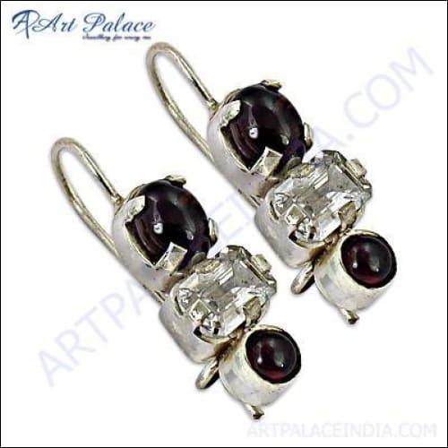 Elegant silver earrings featuring garnet CZ gemstones, showcasing a sophisticated design perfect for any occasion.
