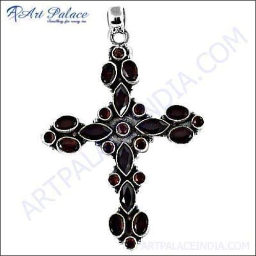Elegant garnet gemstone cross pendant crafted in sterling silver, showcasing intricate design and rich red color.