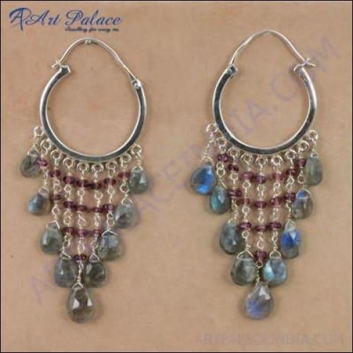 Elegant silver earrings featuring garnet and labradorite gemstones, perfect for party wear.