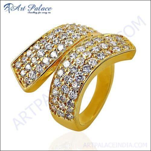 Elegant gold-plated silver bypass ring featuring sparkling cubic zirconia stones, showcasing a modern and luxurious design.