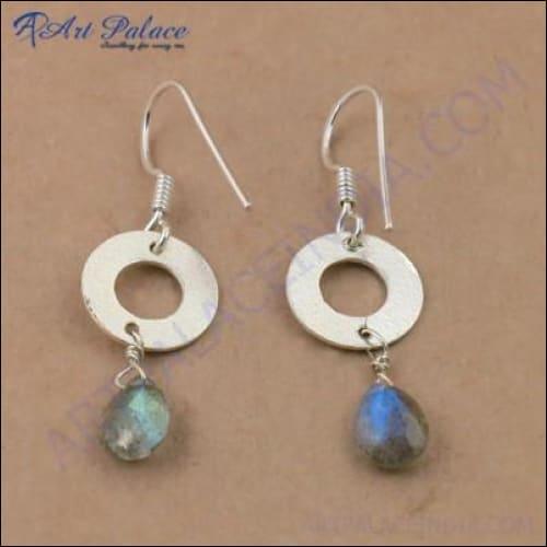 Elegant silver earrings featuring faceted Labradorite gemstones, showcasing their unique iridescent colors and intricate design.