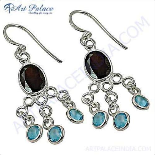 Elegant long silver earrings featuring a beautiful quartz gemstone, showcasing a stylish and sophisticated design.