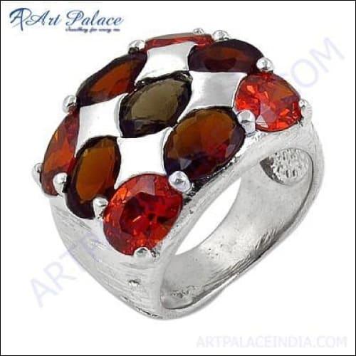 Elegant silver ring featuring orange-red cubic zirconia and smokey glass gemstone, showcasing intricate design and craftsmanship.