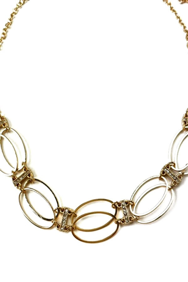 Elegant Oval Cutout Crystal Accent Choker featuring sparkling crystals and a unique design.