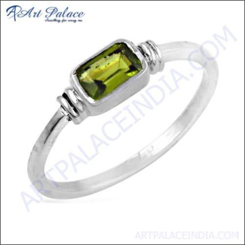 Elegant silver ring featuring a vibrant peridot gemstone, showcasing a delicate design perfect for any occasion.