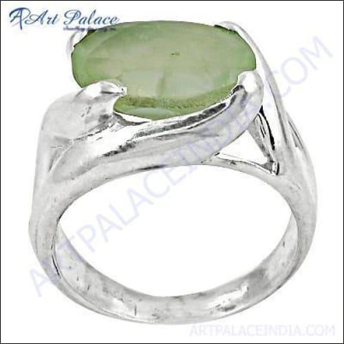 Elegant silver ring featuring a beautiful prehnite gemstone, showcasing intricate craftsmanship and a stylish design.
