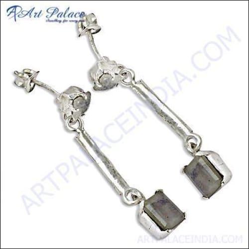 Elegant silver earrings featuring rainbow moonstone, showcasing a unique design with shimmering colors.