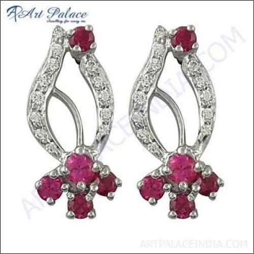Elegant red cubic zirconia gemstone silver earrings showcasing intricate design and vibrant color.