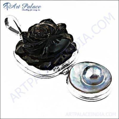 Elegant silver pendant featuring a rose pearl and smokey quartz, showcasing intricate craftsmanship and stylish design.