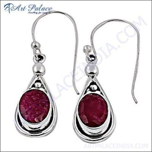 Elegant Ruby and Silver Hook Earrings showcasing vibrant rubies set in a sleek silver design, perfect for any occasion.