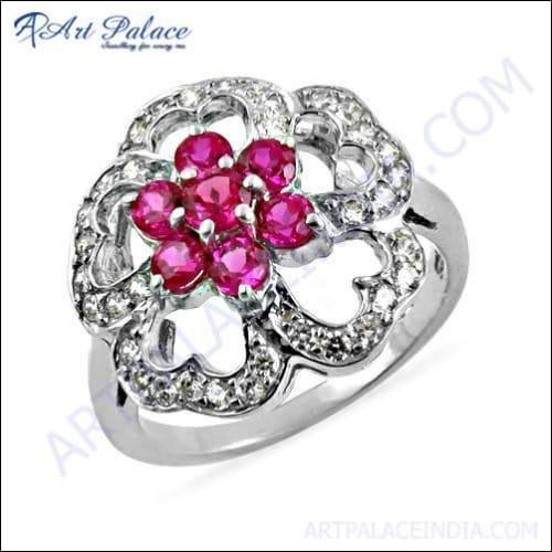 Elegant silver ring featuring red and white cubic zirconia in a beautiful flower shape, showcasing intricate design and craftsmanship.